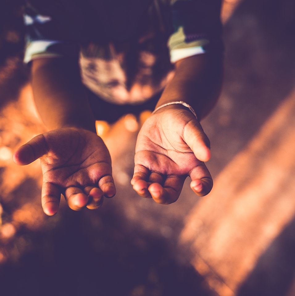 Closeup of a boy with open hands