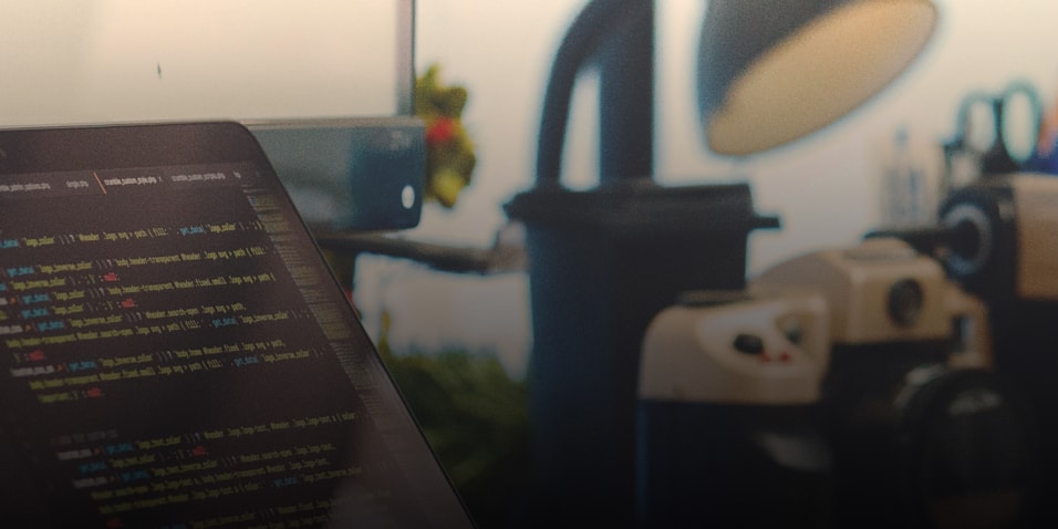 computer with lines of code on screen